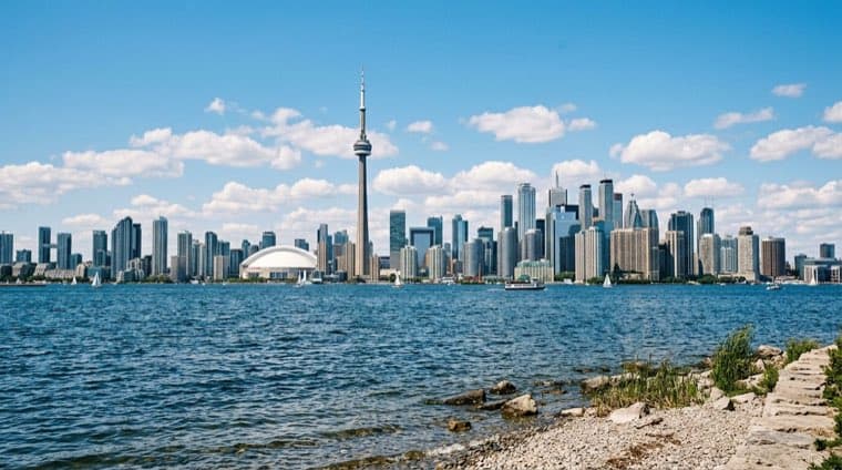 The Toronto skyline and CN Tower seen across Lake Ontario.